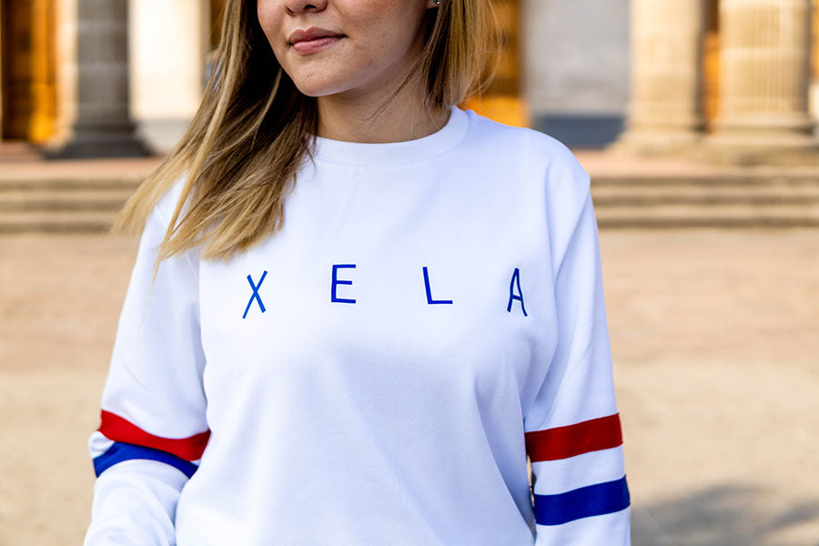 X E L A